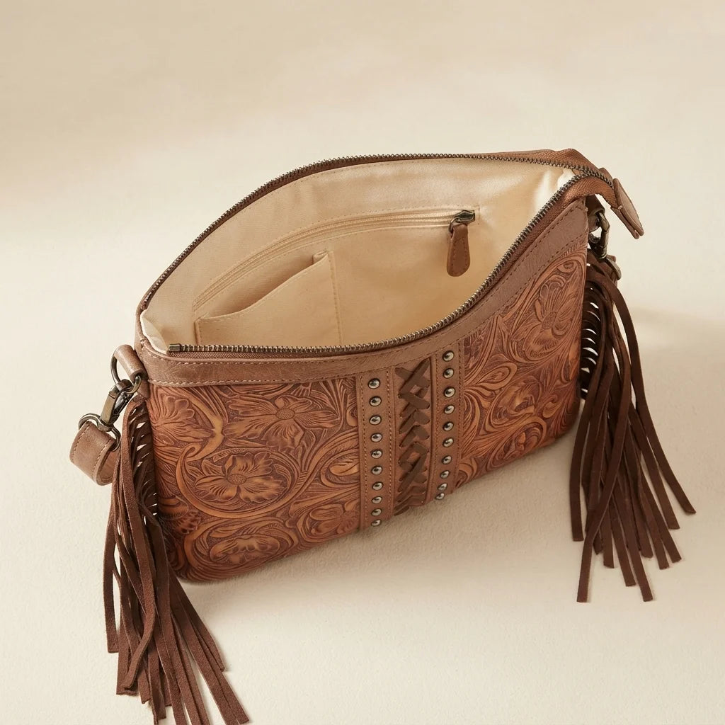 Interior lining and pockets of Coffee handcrafted leather fringe crossbody bag