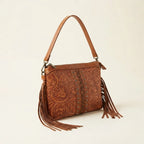 Coffee handcrafted leather fringe crossbody bag, three-quarter angle showing side depth