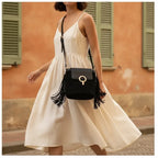 Woman wearing Black hippie fringe crossbody bag with swaying fringe