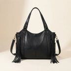 Back panel of Black large black fringe bag with strap attachments