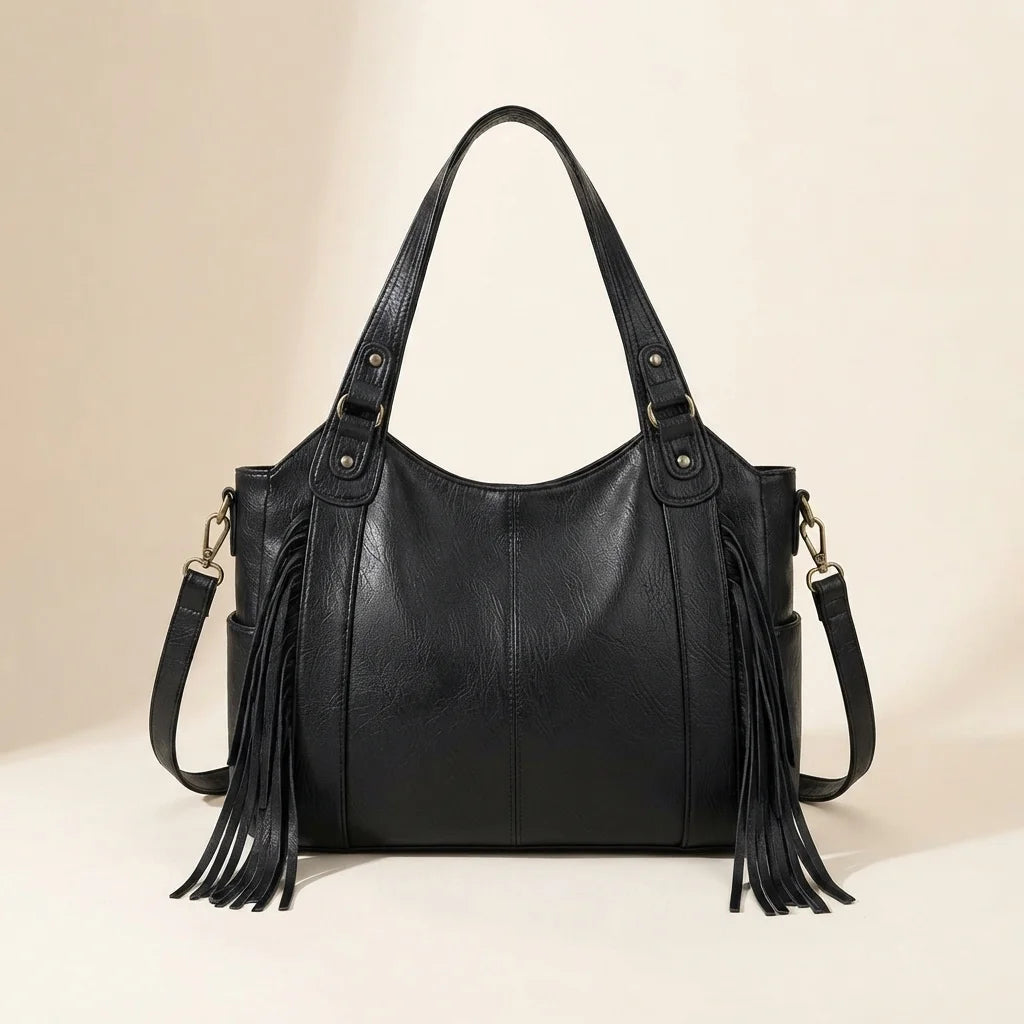 Back panel of Black large black fringe bag with strap attachments