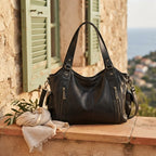 Black large black fringe bag styled in a warm Mediterranean setting