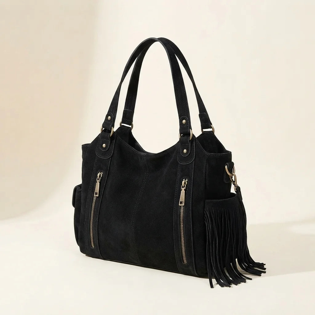 Black large black fringe bag, three-quarter angle showing side depth