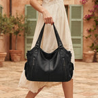 Woman wearing Black large black fringe bag with swaying fringe