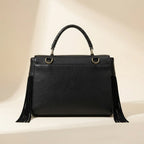 Back panel of Black large fringe clutch bag with strap attachments
