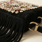 Close-up of fringe stitching and texture on Black large fringe clutch bag