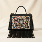 Black large fringe clutch bag, front view