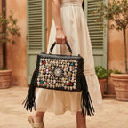Woman wearing Black large fringe clutch bag with swaying fringe