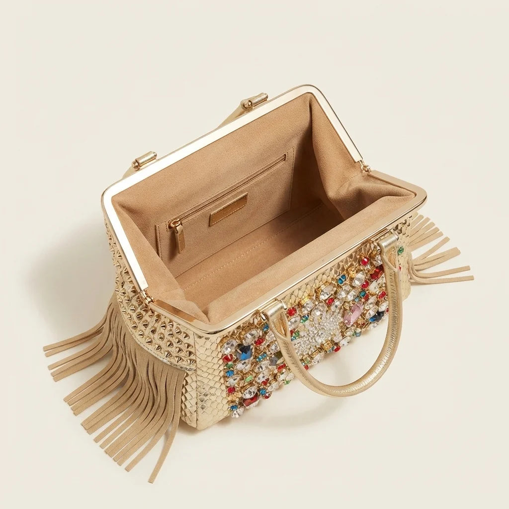 Interior lining and pockets of Gold large fringe clutch bag