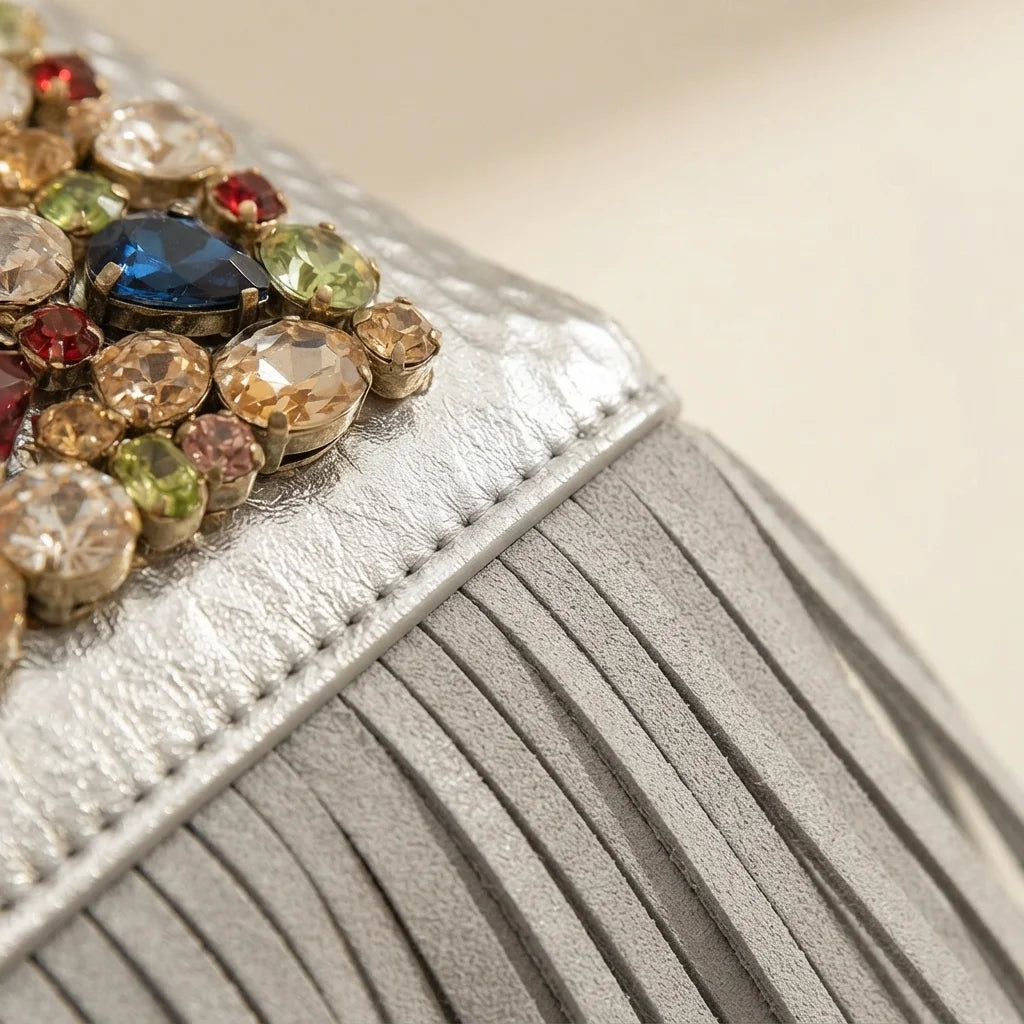 Close-up of fringe stitching and texture on Silver large fringe clutch bag