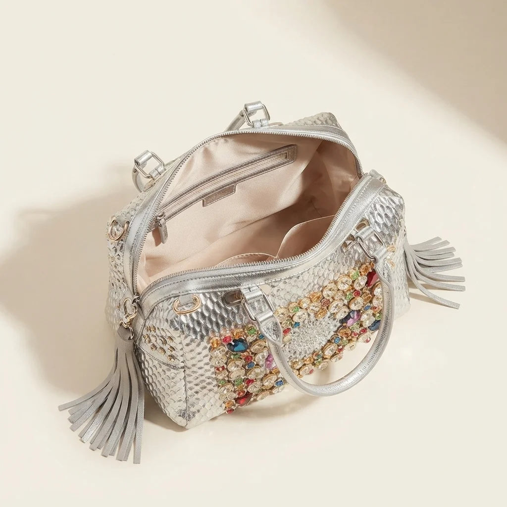 Interior lining and pockets of Silver large fringe clutch bag