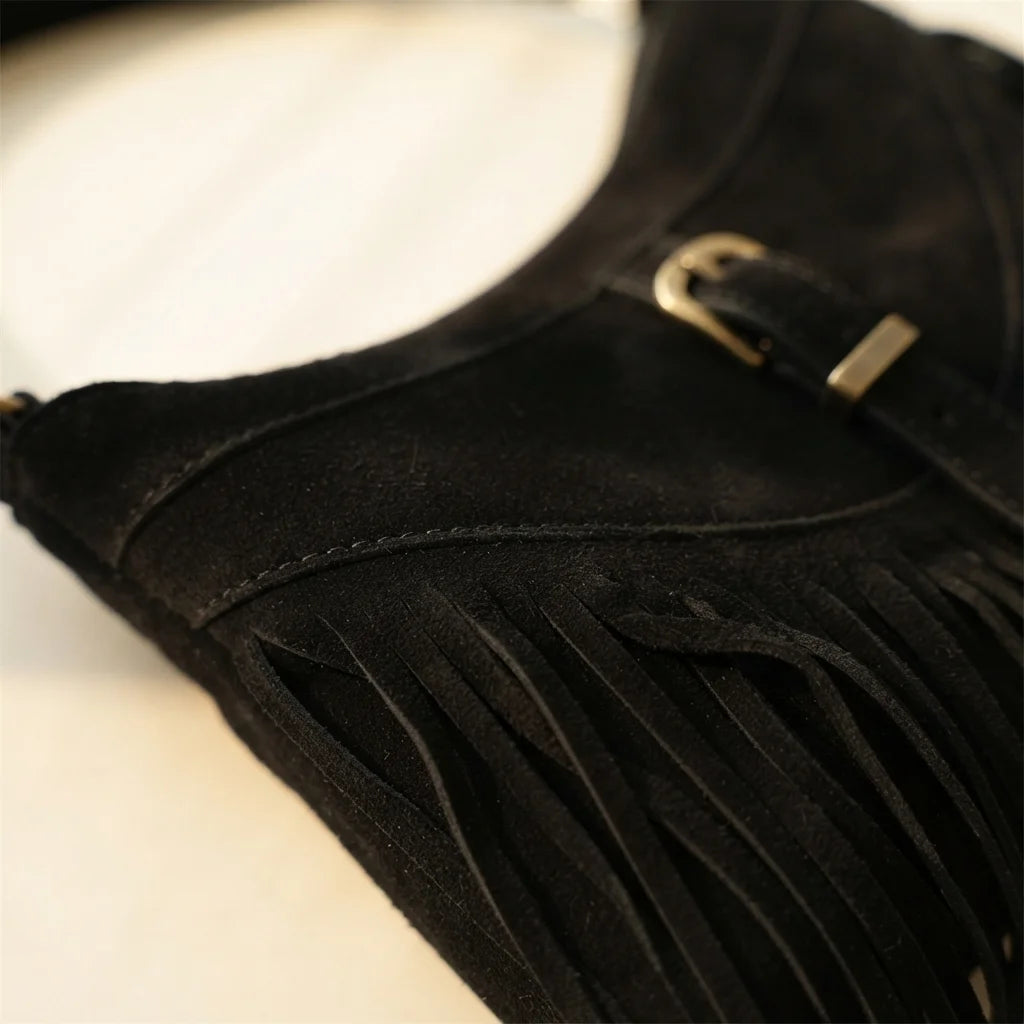 Close-up of fringe stitching and texture on Black large fringe crossbody bag
