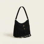 Black large fringe crossbody bag, three-quarter angle showing side depth