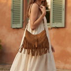 Woman wearing Coffee large fringe crossbody bag with swaying fringe