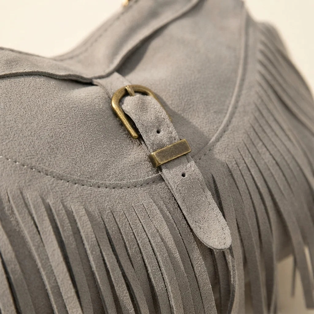 Close-up of fringe stitching and texture on Grey large fringe crossbody bag