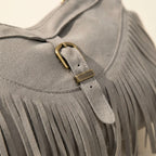 Close-up of fringe stitching and texture on Grey large fringe crossbody bag