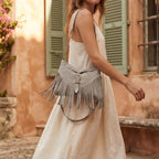Woman wearing Grey large fringe crossbody bag with swaying fringe