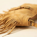 Close-up of fringe stitching and texture on Light Brown large fringe crossbody bag