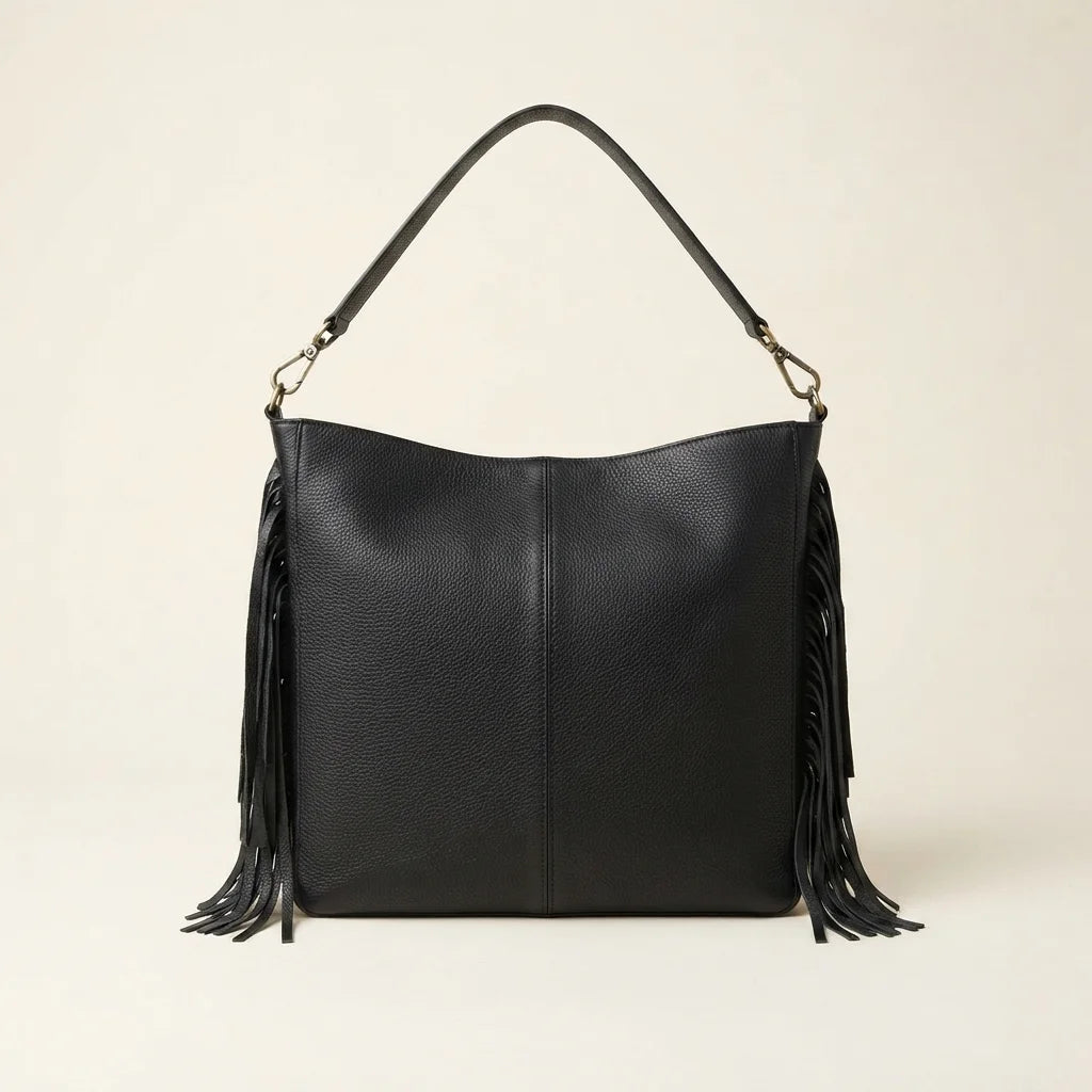 Back panel of Black large fringe faux leather hobo bag with strap attachments