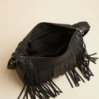 Interior lining and pockets of Black large fringe faux leather hobo bag