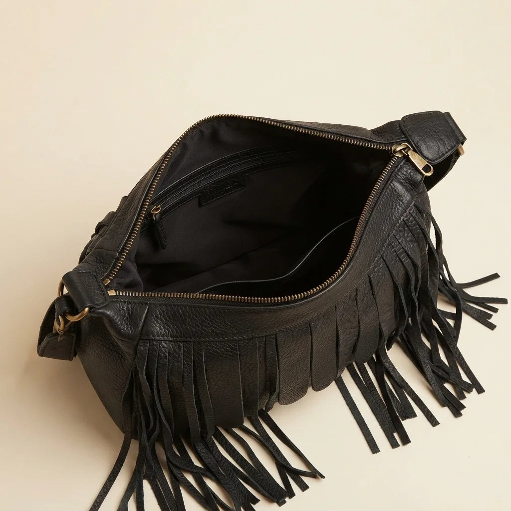 Interior lining and pockets of Black large fringe faux leather hobo bag