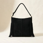 Back panel of Black large fringe hobo bag with strap attachments