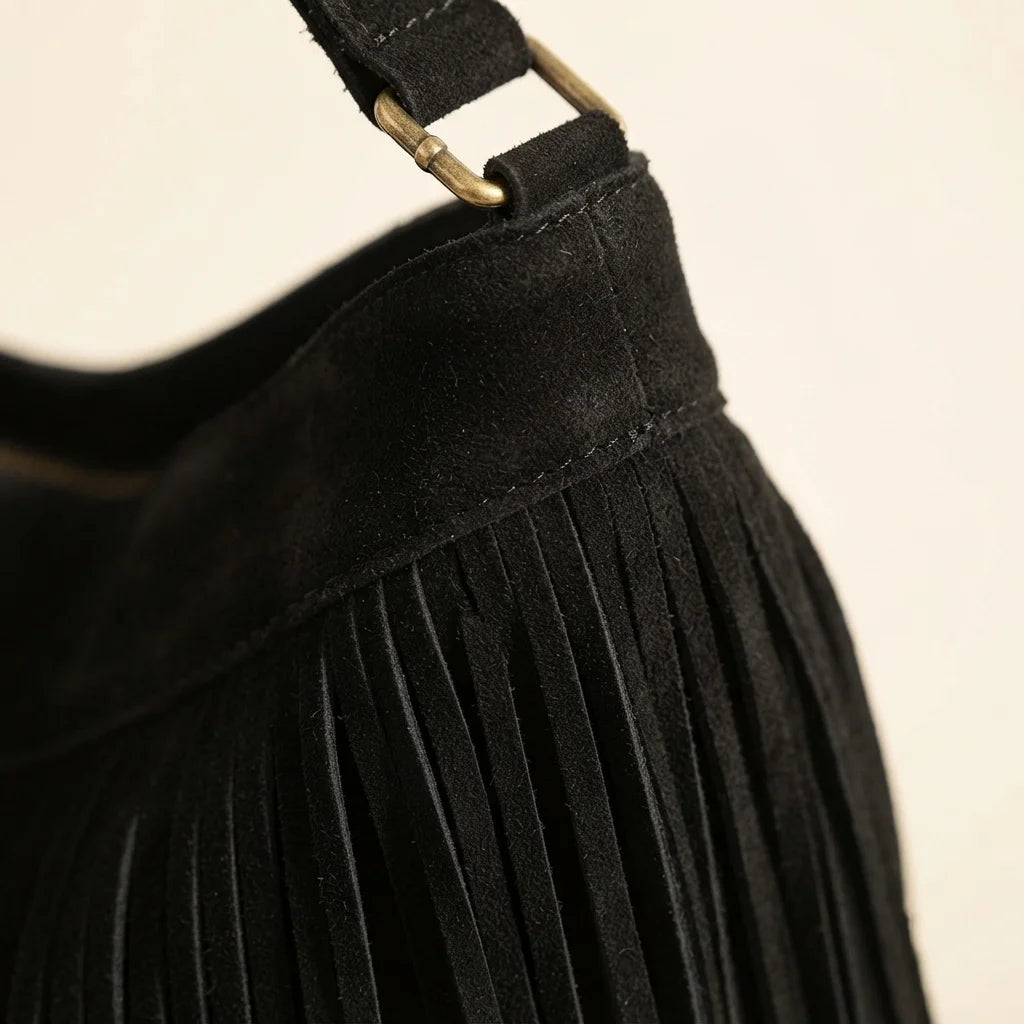 Close-up of fringe stitching and texture on Black large fringe hobo bag