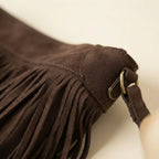 Close-up of fringe stitching and texture on Coffee large fringe hobo bag