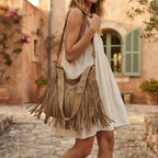 Woman wearing Khaki large fringe hobo bag with swaying fringe