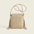 Back panel of Beige large fringe shoulder bags with strap attachments