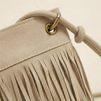 Close-up of fringe stitching and texture on Beige large fringe shoulder bags