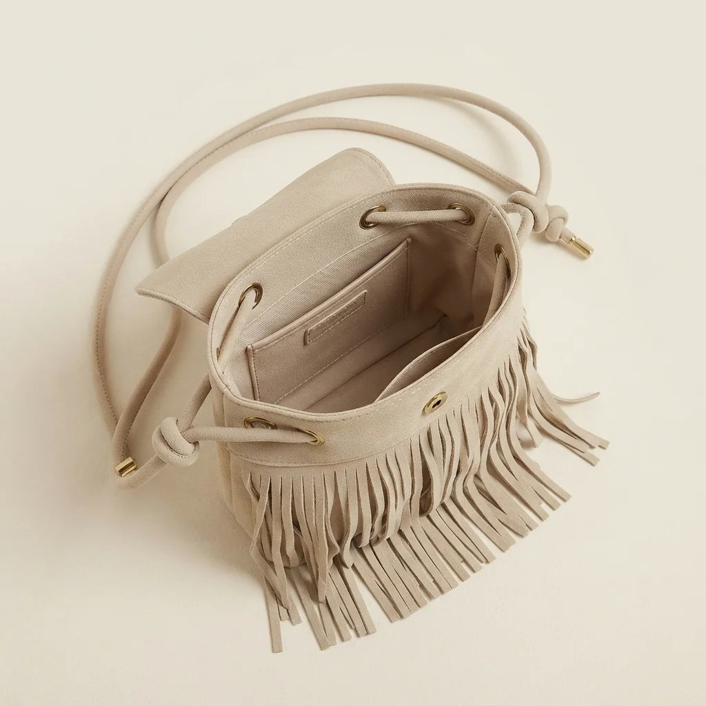 Interior lining and pockets of Beige large fringe shoulder bags