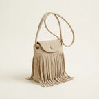 Beige large fringe shoulder bags, three-quarter angle showing side depth