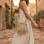 Woman wearing Beige large fringe shoulder bags with swaying fringe