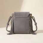 Back panel of Grey large fringe shoulder bags with strap attachments
