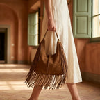 Woman wearing Brown large hippie fringe bag with swaying fringe