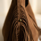 Close-up of fringe stitching and texture on Coffee large hippie fringe bag