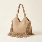 Beige large macrame fringed tote bag, three-quarter angle showing side depth