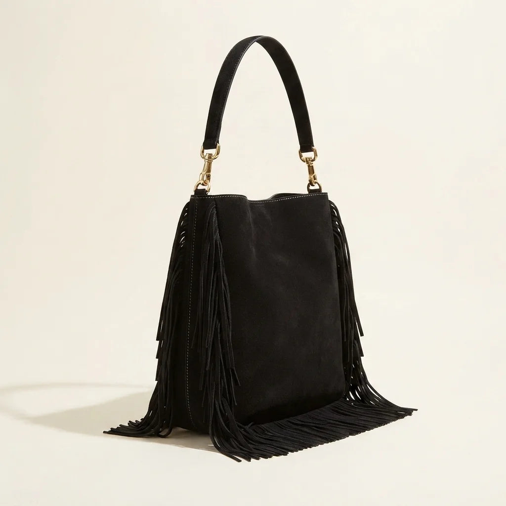 Black large suede fringe bag, three-quarter angle showing side depth