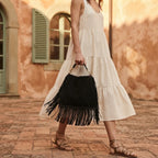 Woman wearing Black large suede fringe bag with swaying fringe