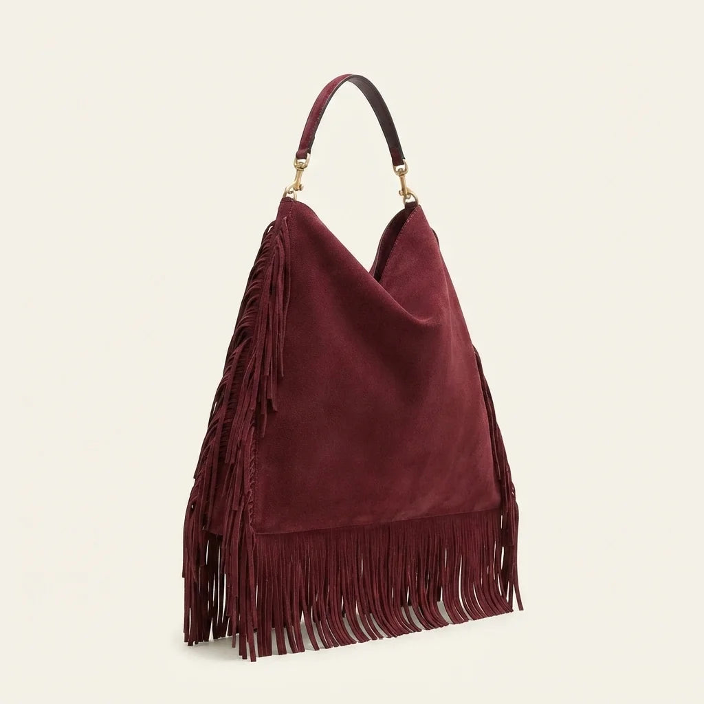 Maroon large suede fringe bag, three-quarter angle showing side depth