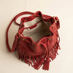 Interior lining and pockets of Red leather bucket bag with fringes