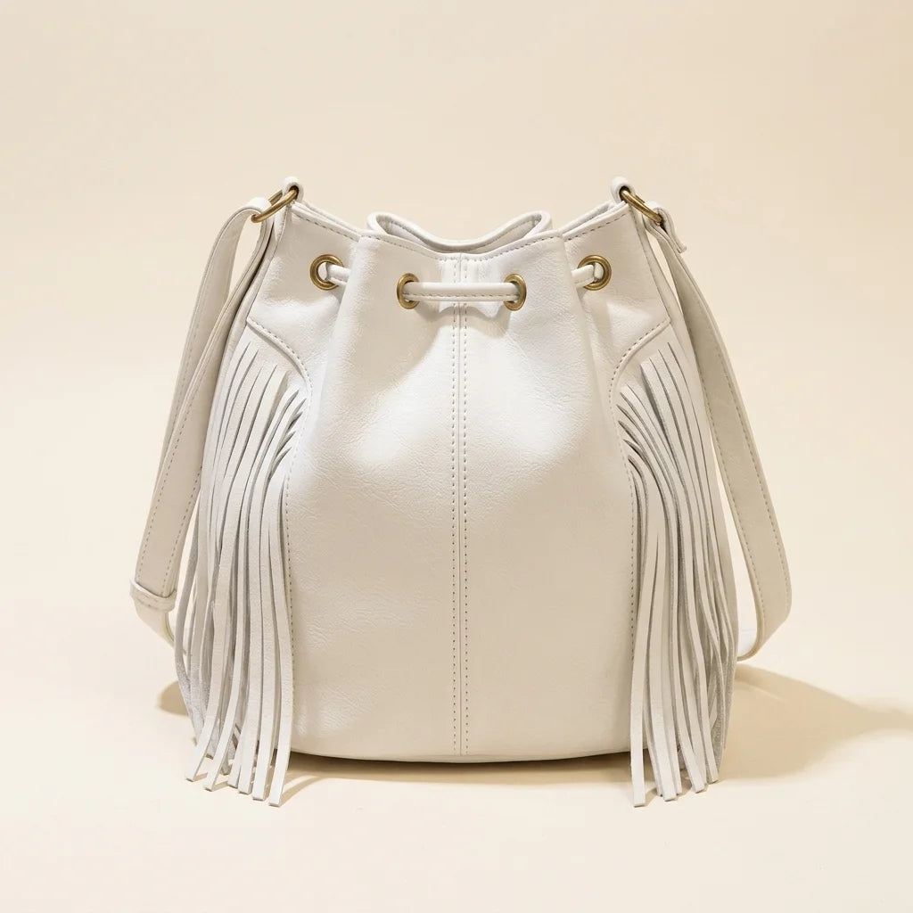 Back panel of White leather bucket bag with fringes with strap attachments