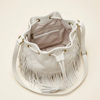 Interior lining and pockets of White leather bucket bag with fringes