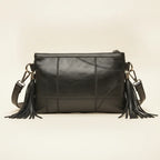 Back panel of Black leather clutch bags with side fringe with strap attachments