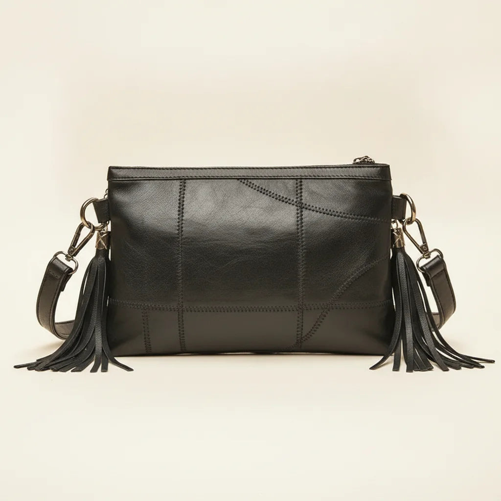 Back panel of Black leather clutch bags with side fringe with strap attachments