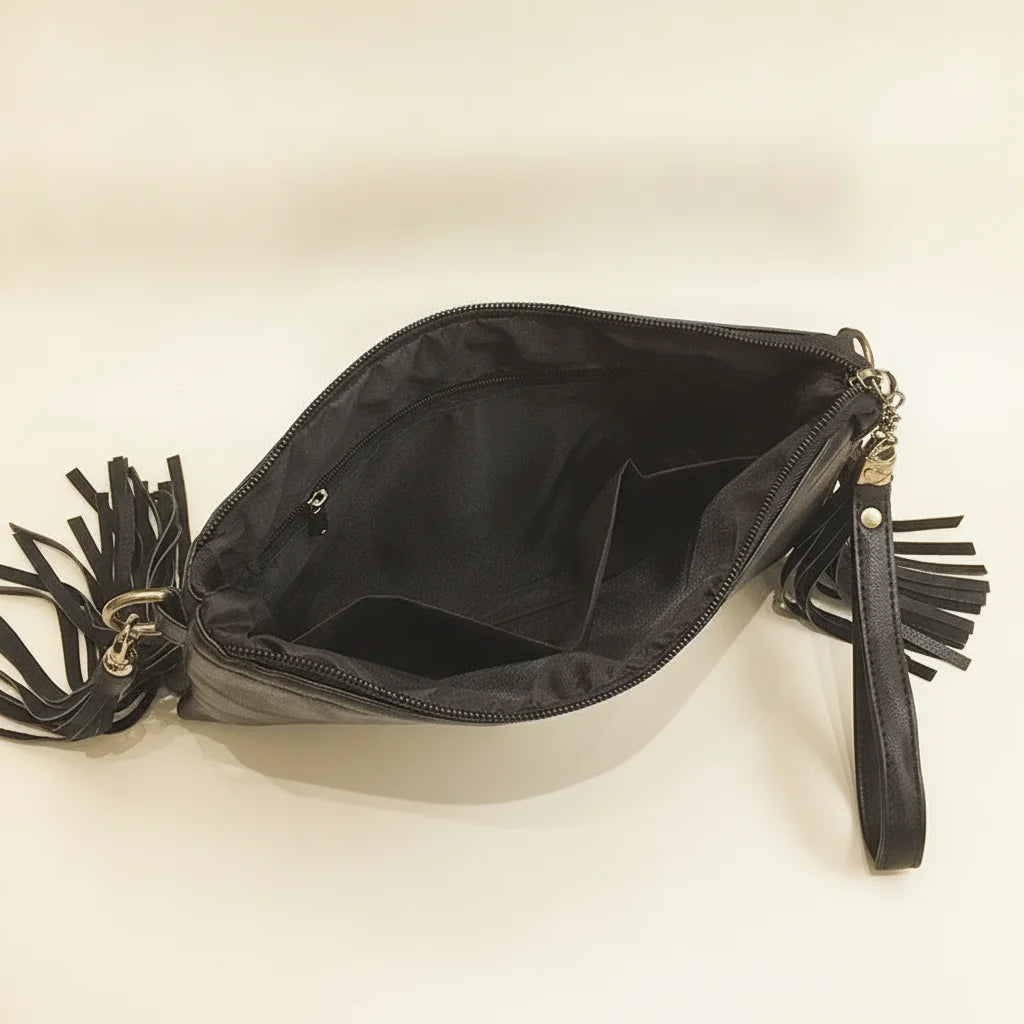 Interior lining and pockets of Black leather clutch bags with side fringe