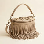 Beige leather fringe belt bag, three-quarter angle showing side depth