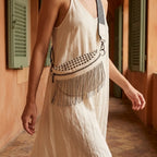 Woman wearing Beige leather fringe belt bag with swaying fringe