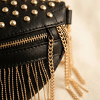 Close-up of fringe stitching and texture on Black leather fringe belt bag